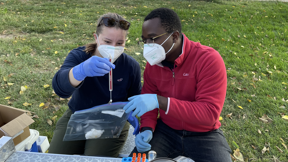 Marnee and Ben weighing item for research purposes